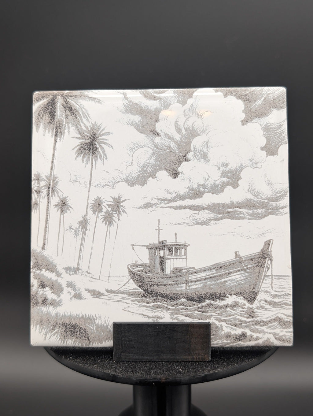 Custom photo tile hero example with boat landscape engraving displayed on stand