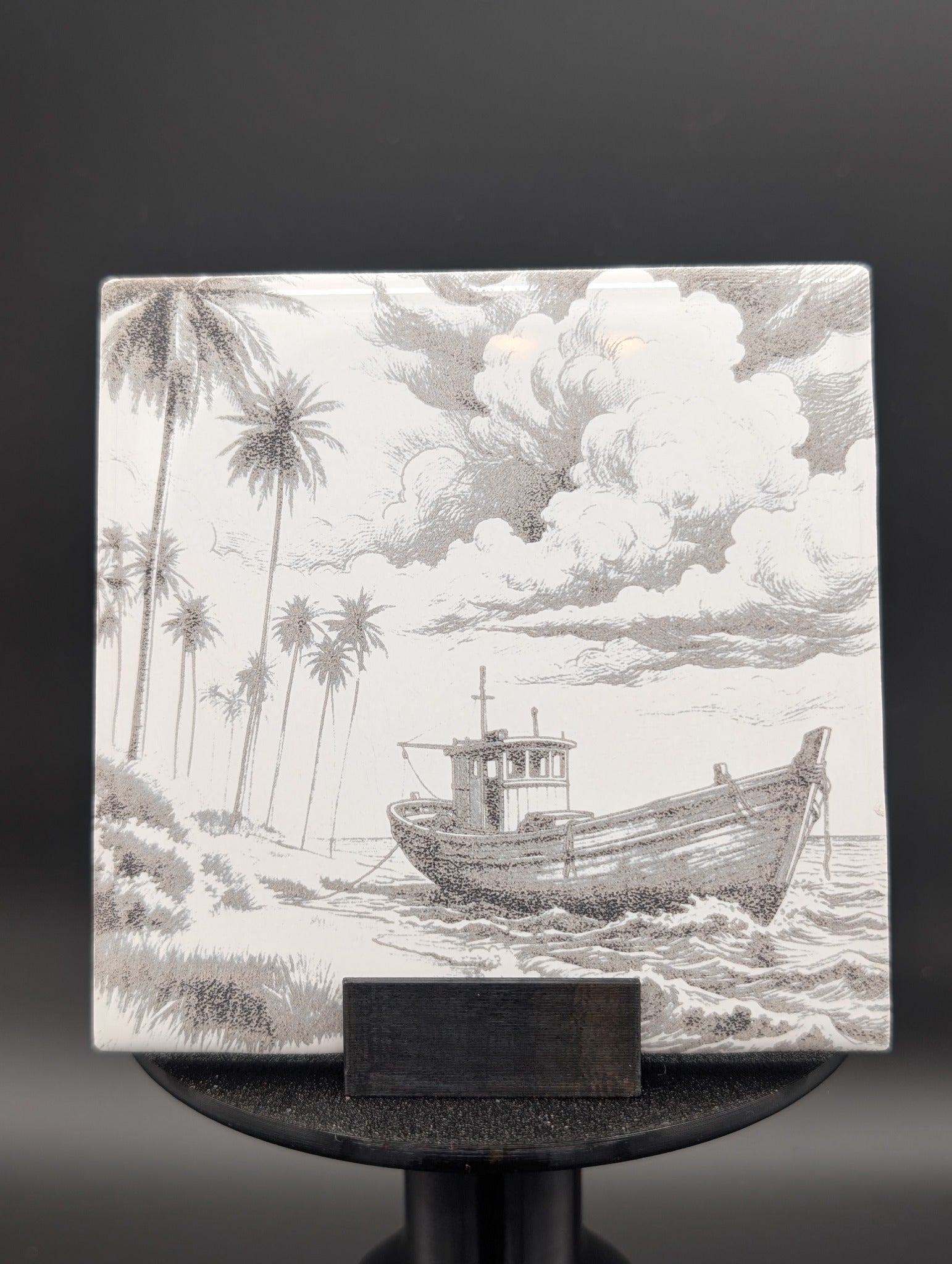 Custom photo tile hero example with boat landscape engraving displayed on stand