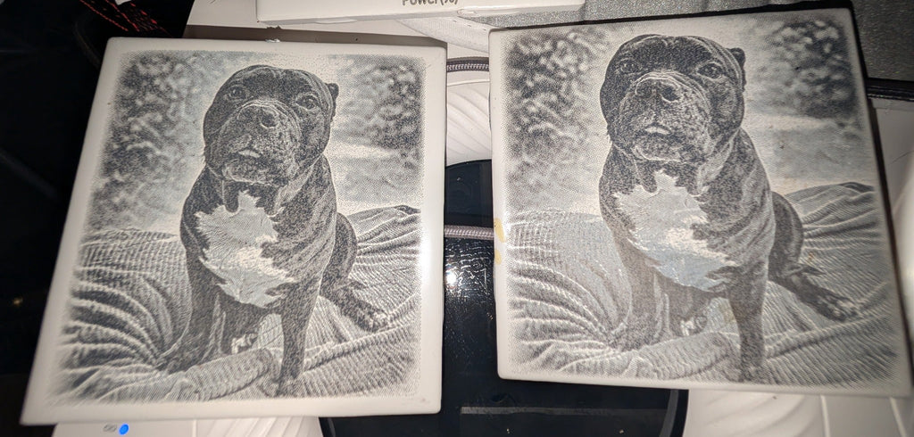 Custom pet MemoryTile process example showing engraved dog photo tiles during testing