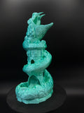 Front view of green and aqua basilisk dice tower with dice tray