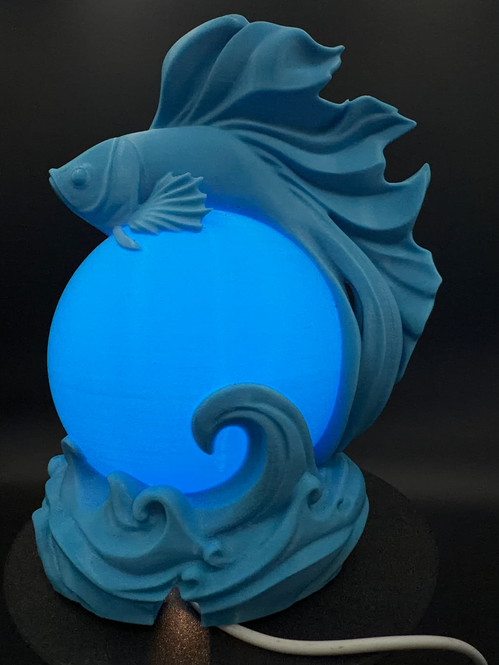 Blue Betta lamp lit from another front angle