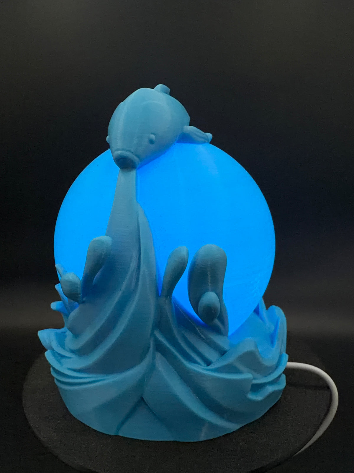 Blue Koi lamp illuminated from the rear