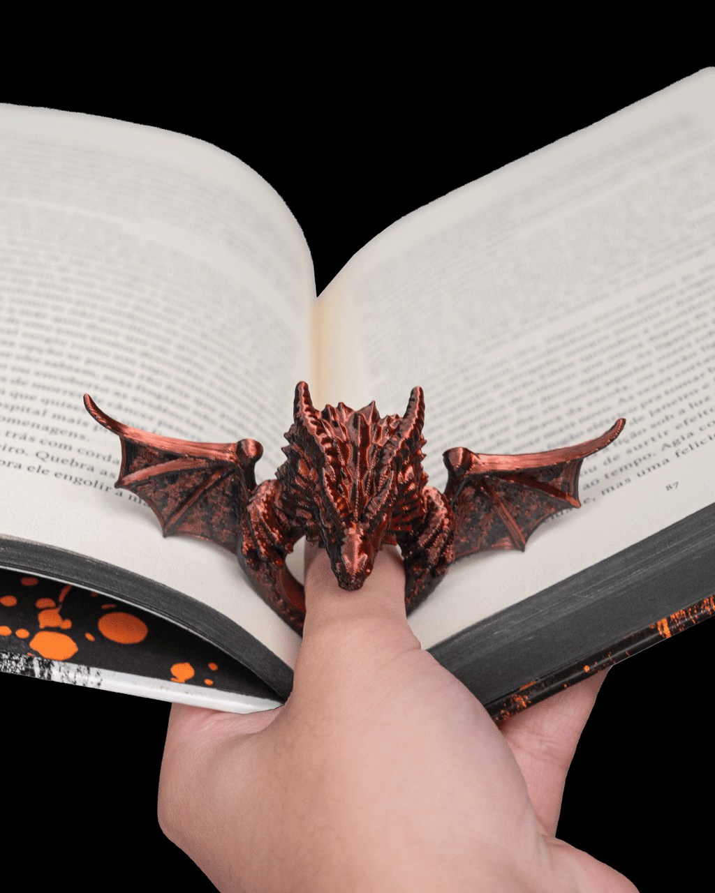 Closeup of Dragonwing Page Holder on an open book