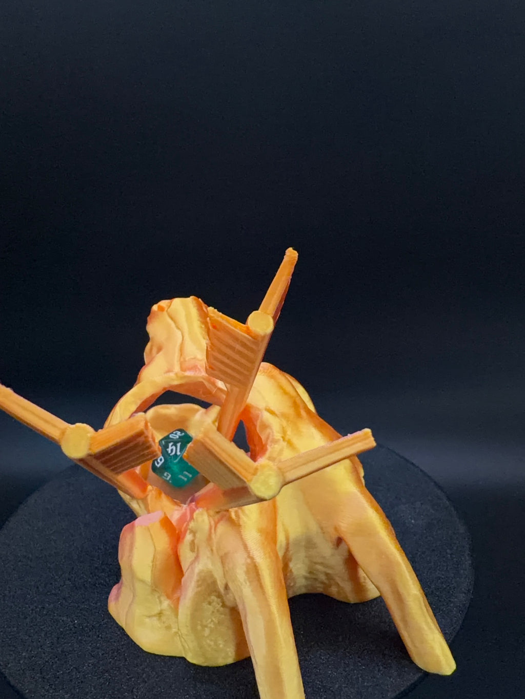 Rear view of arrows behind skull dice tower