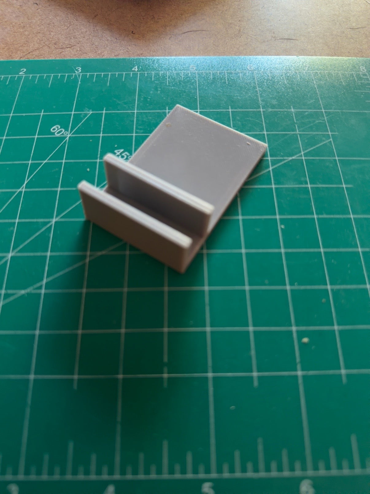 Custom ceramic MemoryTile displayed upright on included basic display stand