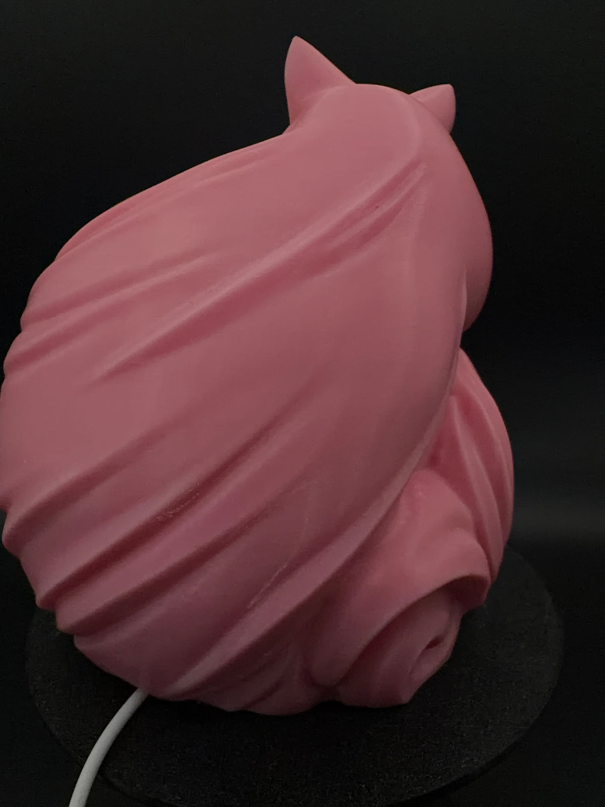 Rear of pink fox lamp showing USB cord