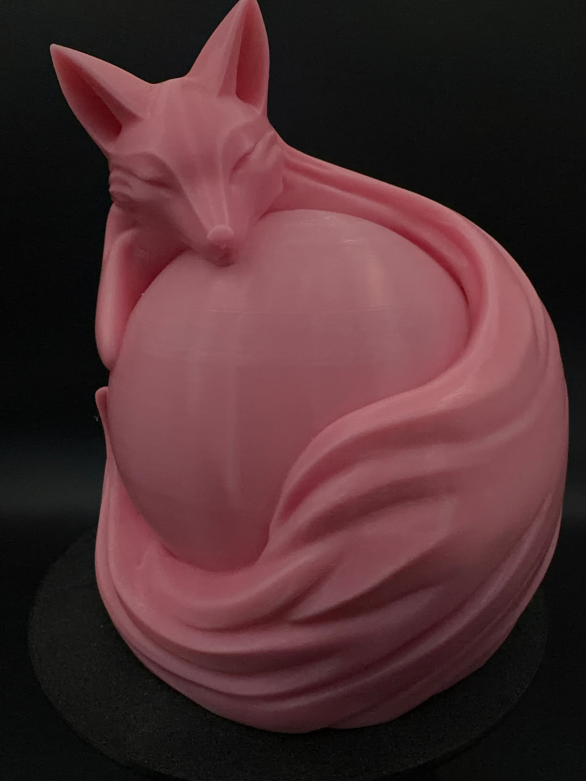 Pink fox lamp unlit at an angle
