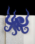 Blue collectible bookmark shown on an open book