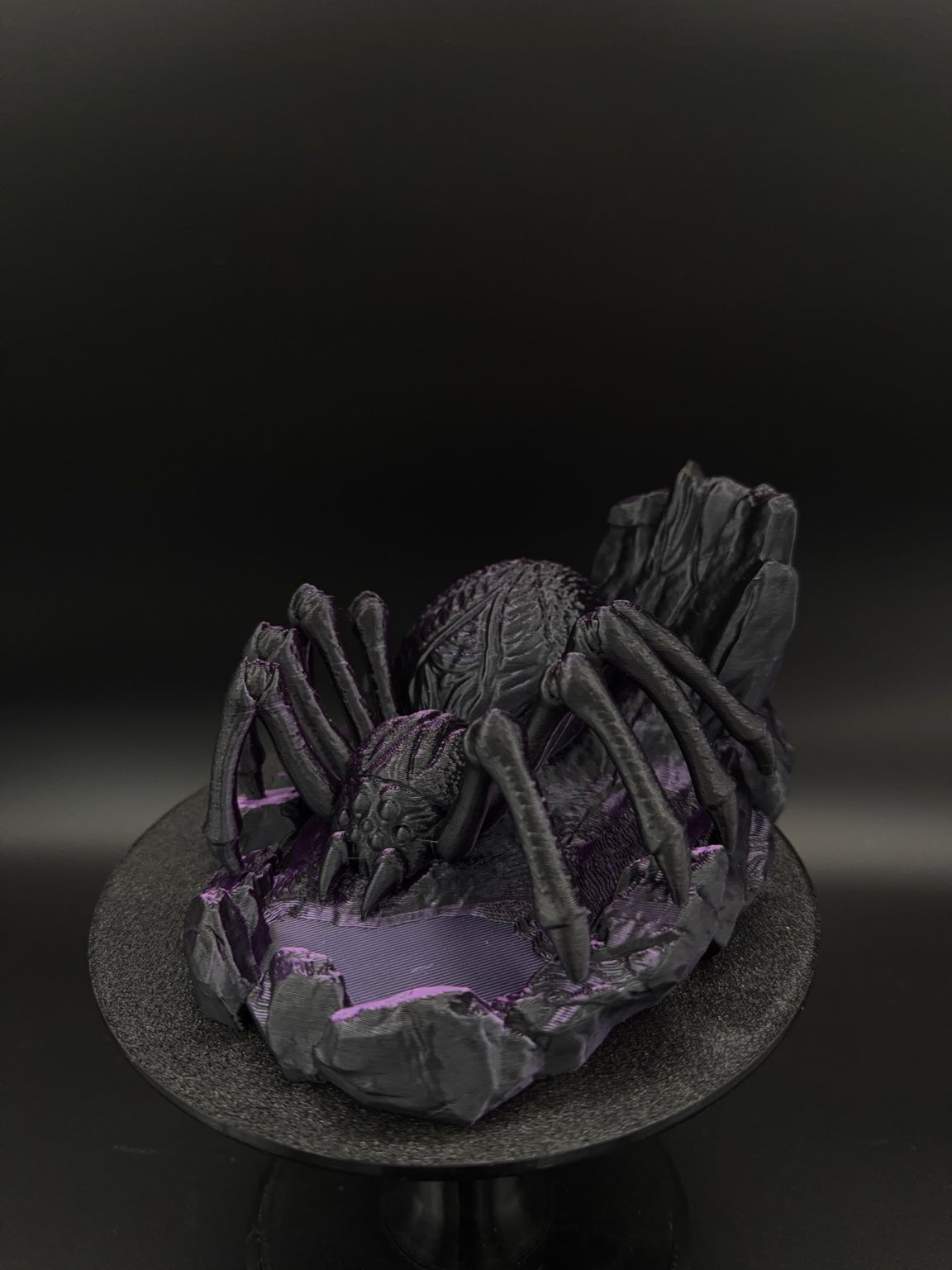 Angled view of spider dice tower and rocky dice tray