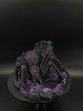 Front view of black and purple spider dice tower