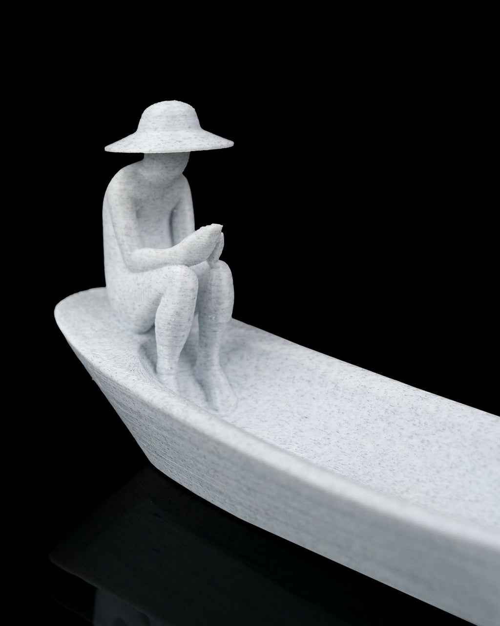 Still Waters incense holder close detail view of seated figure and boat-shaped tray texture