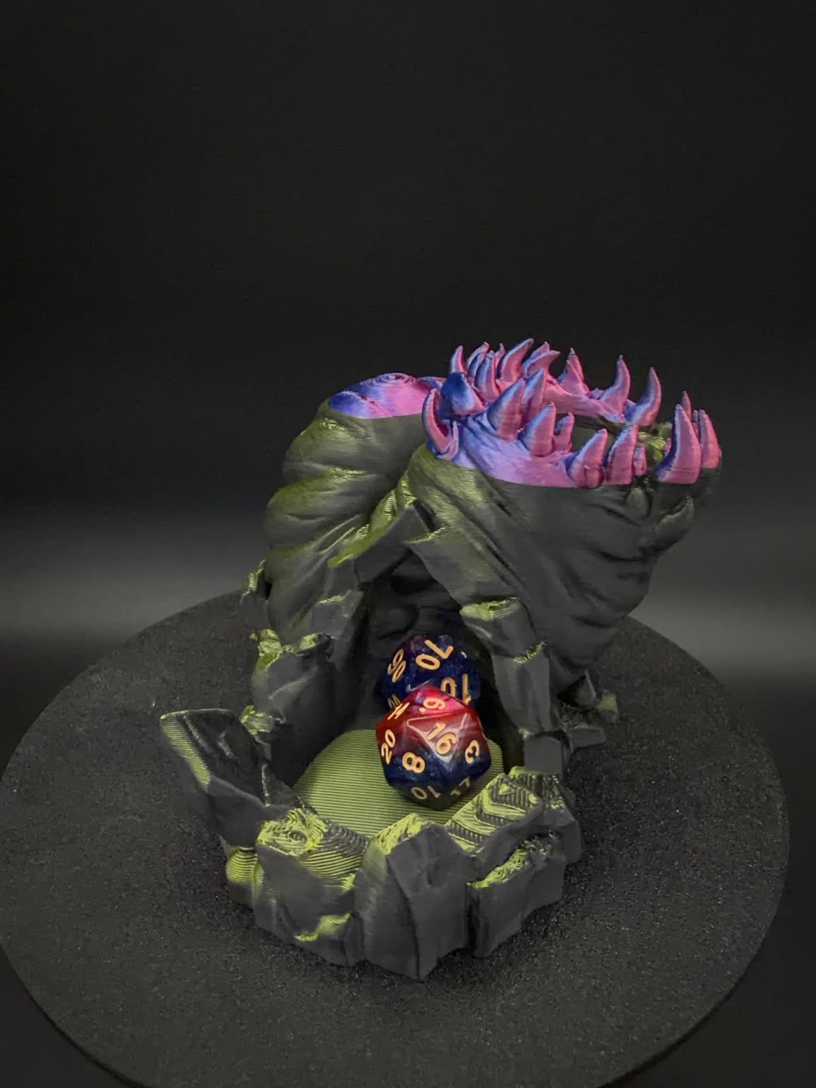 Front tray of multicolor Void Maw dice tower with dice [Black Gold]