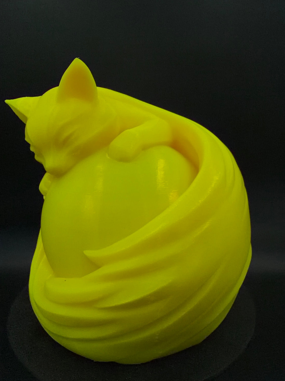Yellow Cat lamp unlit from an angle